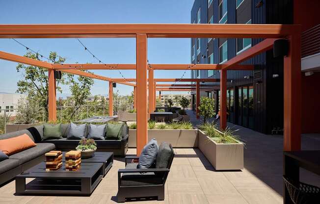 A patio with a table and chairs.