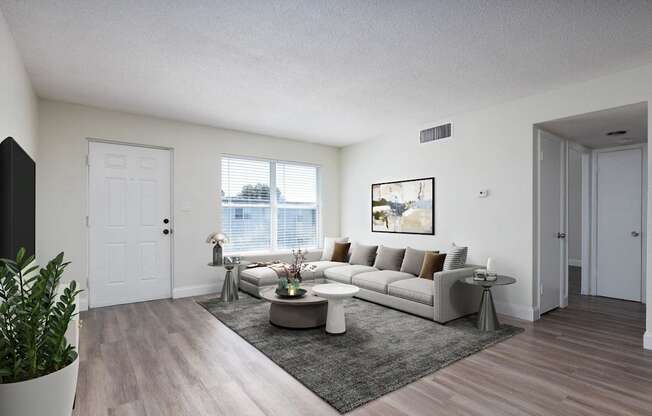 our apartments offer a living room with a couch and a coffee table