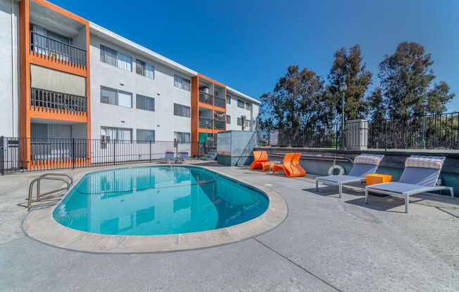 our apartments have a resort style pool and lounge chairs at Citra Apartments LLC, San Diego, California