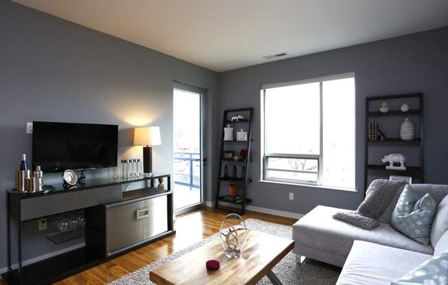 a living room with a couch and a tv