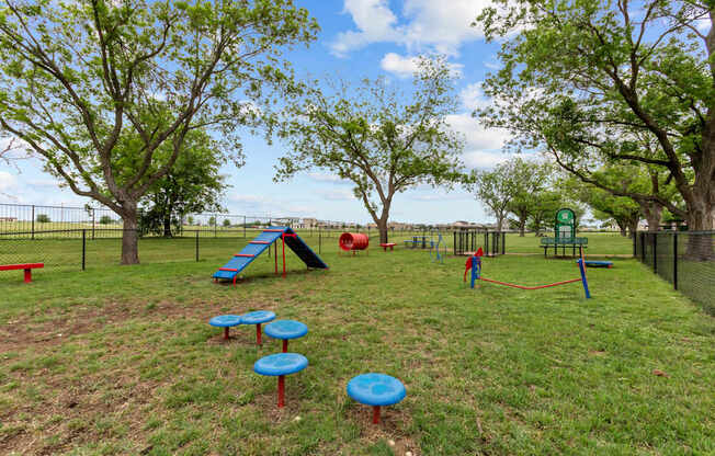 A playground with a slide, swings, and a ball pit.