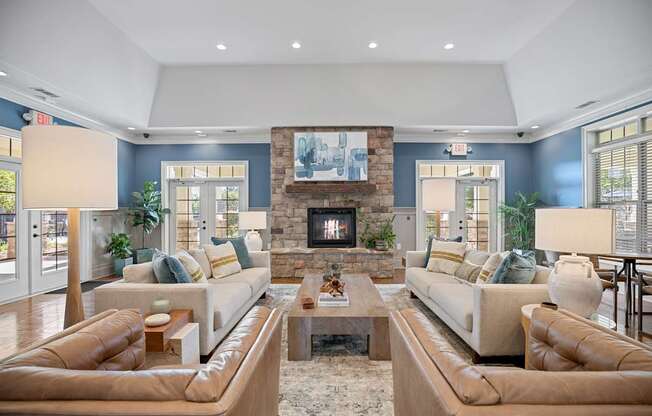 A living room with two couches and a fireplace.