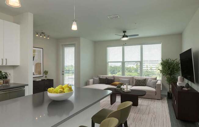 A modern kitchen with a bowl of lemons on the counter.