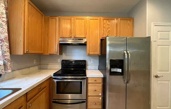 Beautiful Two-Level Townhouse with Gas Fireplace, Vaulted Primary Suite, and Fenced Backyard!