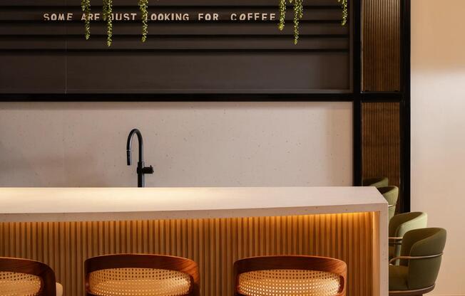 A resident coffee bar with warm wood detailing and ambient lighting—your go-to spot before heading out along Rio Salado.