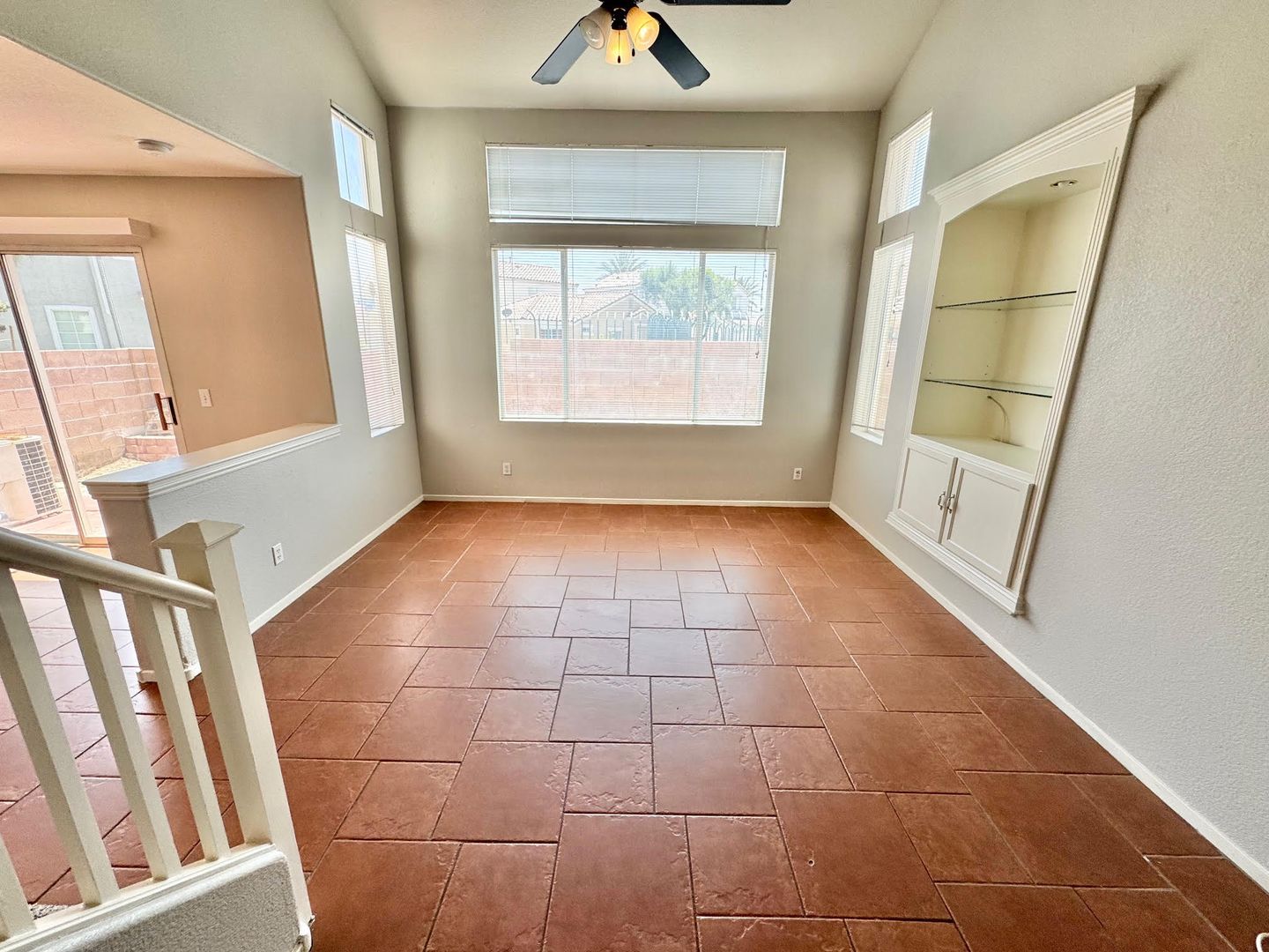THIS IS A CHARMING TWO-STORY NORTH LAS VEGAS HOME WITH 2 BEDROOMS, 2.5 BATHS AND A TWO-CAR ATTACHED GARAGE. FEATURING TILE AND CARPET FLOORING, NEUTRAL PAINT, AND BLINDS THROUGHOUT, THE MAIN LEVEL OFFERS AN OPEN LIVING AND DINING AREA THAT FLOWS INTO A KI