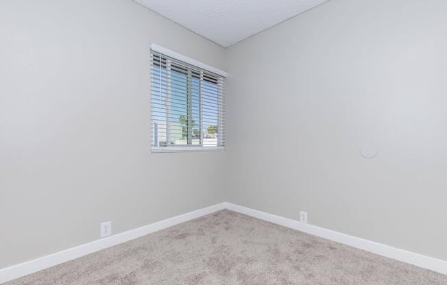 a bedroom with a large mirror