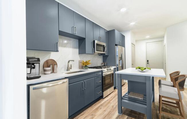 Contemporary kitchens at Modera Westside Trail offer a stylish island and sleek finishes, creating an inviting space for everyday living.