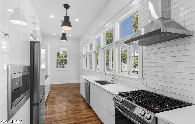 Roosevelt Row historic and updated home close to everything downtown! Truly unique!!!  Absolute stunner that is an Oasis in the City!!!  Everything redone!!  True Charmer!!!