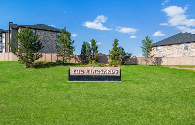 the yard wizards sign in the yard of a house