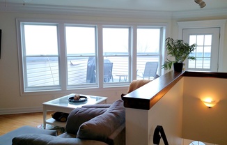 Move-in Special: FIRST MONTH’S RENT FREE!! Beautifully Remodeled 2 Bed/ 2Bath House W/Rooftop Deck - Off Street Parking - Central AC - Hardwood Flooring