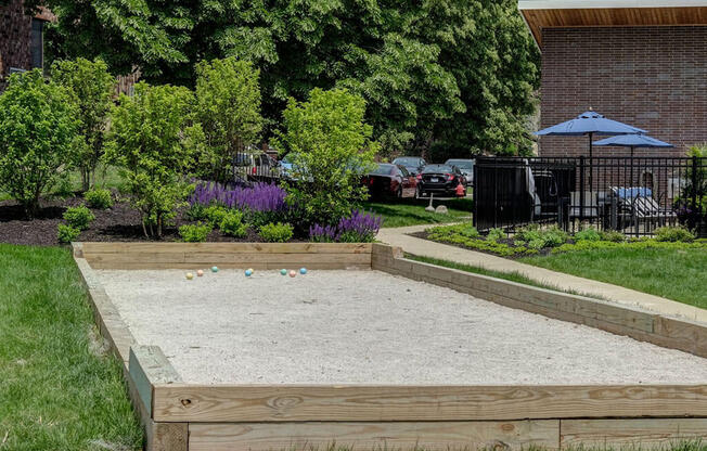 a sandbox in the backyard of a house