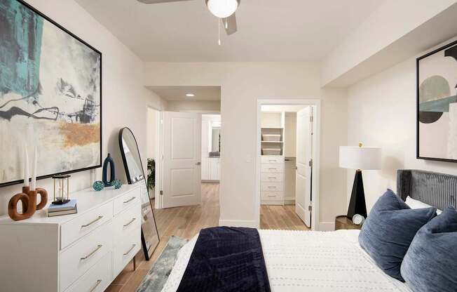 A bedroom with a large bed and a painting on the wall. at Palma, Doral, Florida