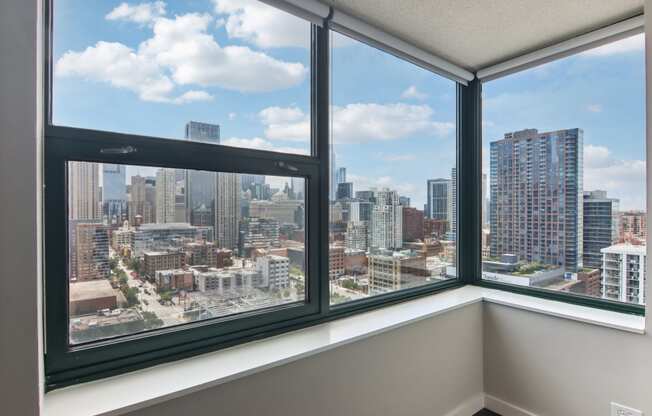 a room with a view of a city skyline from a window
