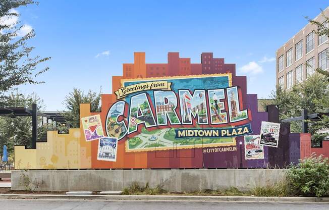 a large mural on the side of a building that reads carmel midtown plaza