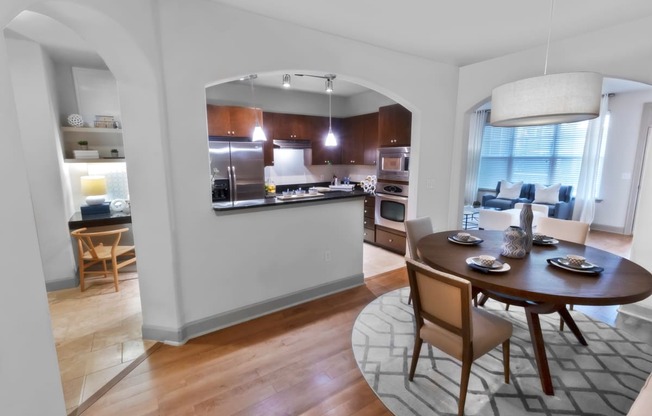 a kitchen and dining area in a 555 waverly unit