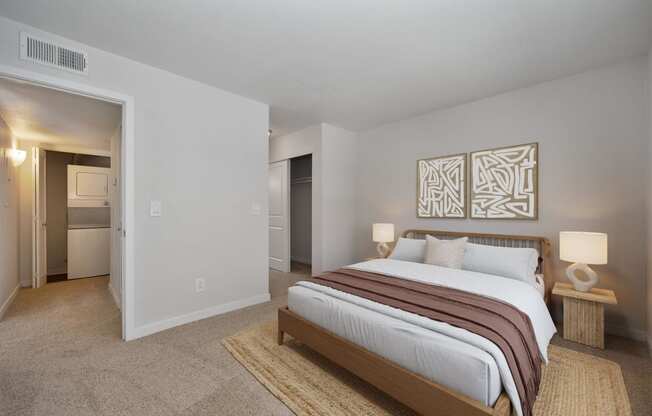 a bedroom with a bed and a closet at Rush River Apartments, California