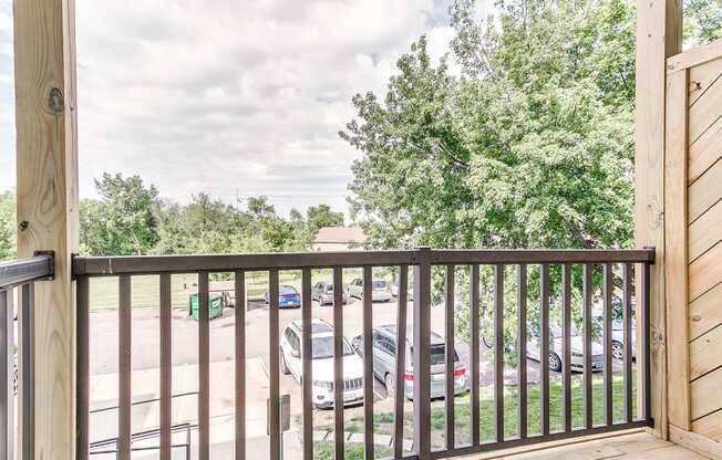 the balcony has a view of the parking lot
