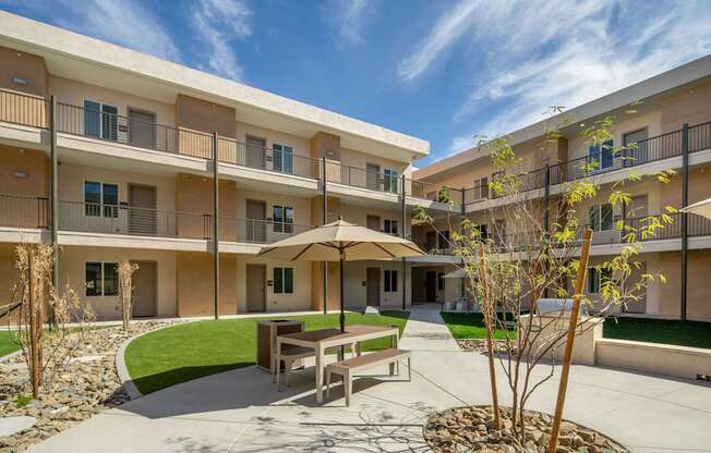 A sunny day at the courtyard of apartment buildings.