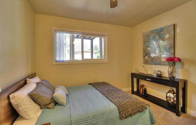large bedroom with ceiling fan and window at The Arbors at Mountain View, California