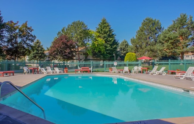 La Verde Apartments Pool Area with Lounge Chairs