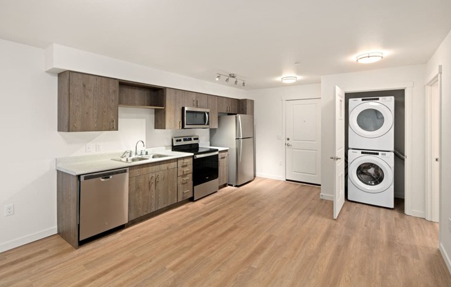 Full kitchen and washer and dryer at POLARIS AT SEATAC, SEATAC, Washington