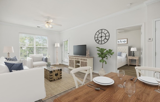 A dining room with a wooden table set for two.