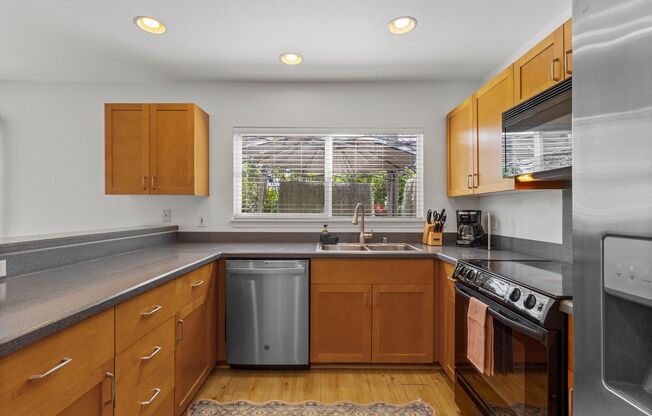Hillside 3 BR House | W/D • 2 Car Garage • A/C