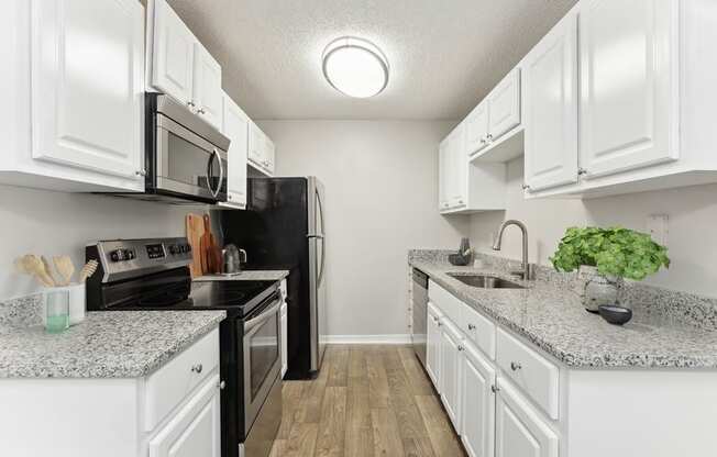 Model kitchen with white cabinets