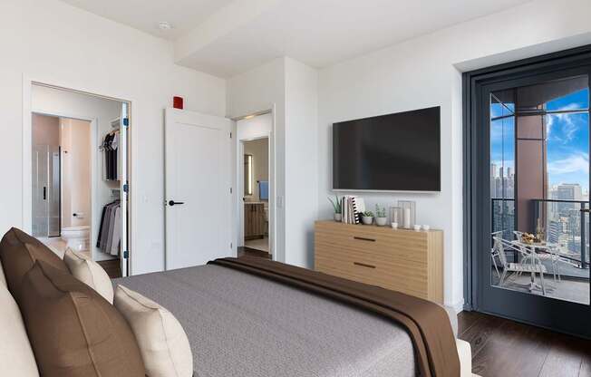 a bedroom with a large bed and a tv on the wall at Cassidy on Canal, Chicago, IL