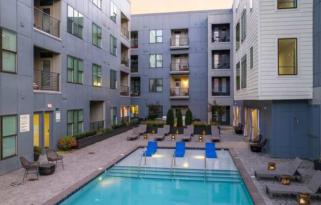 a swimming pool in the middle of an apartment building