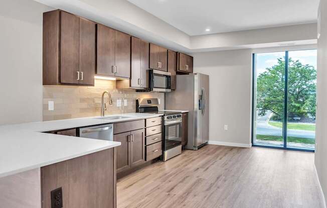 A kitchen with wooden cabinets and a white countertop.