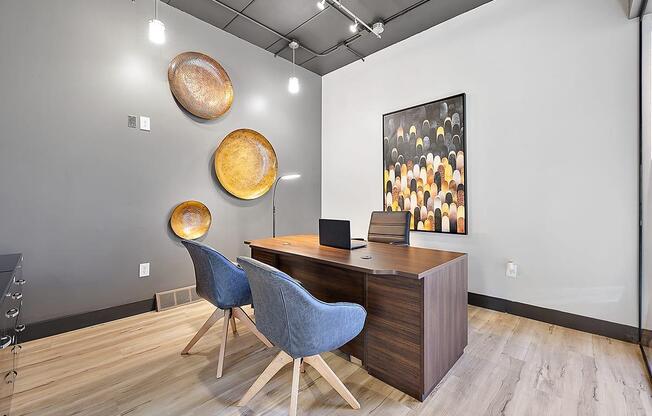 a conference room with a wooden desk and chairs at Troy Place Apartments - Troy, MI, Troy, Michigan