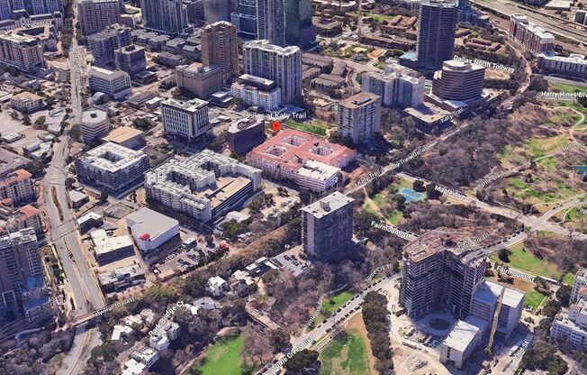 an aerial view of a city with tall buildings