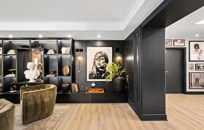 A modern living room with a brown leather chair and a wooden floor at Chateau on Wells, Chicago, IL