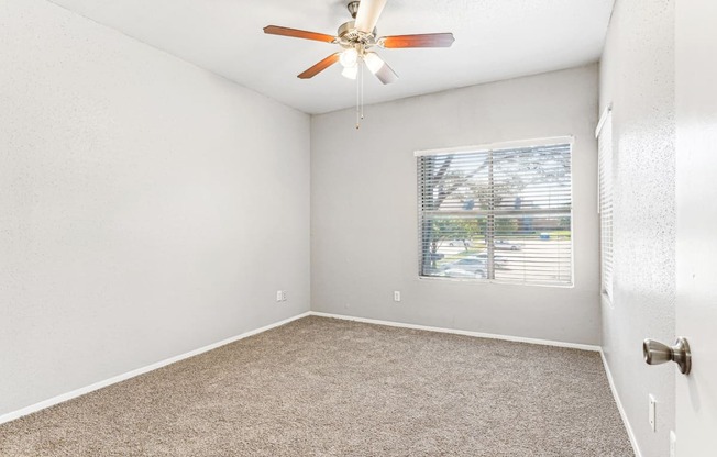 Quiet bedroom with large windows at Laurels of Sendera apartments in Arlington, TX