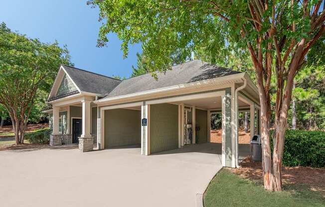A house with a grey roof and a garage door.