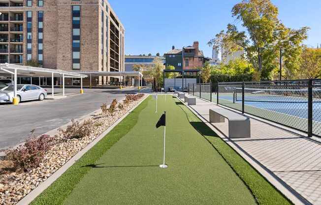 a tennis court with a net in the middle of a street