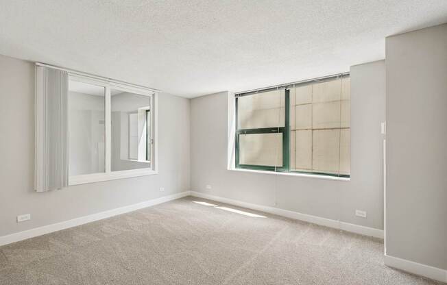 A room with a window and a door.