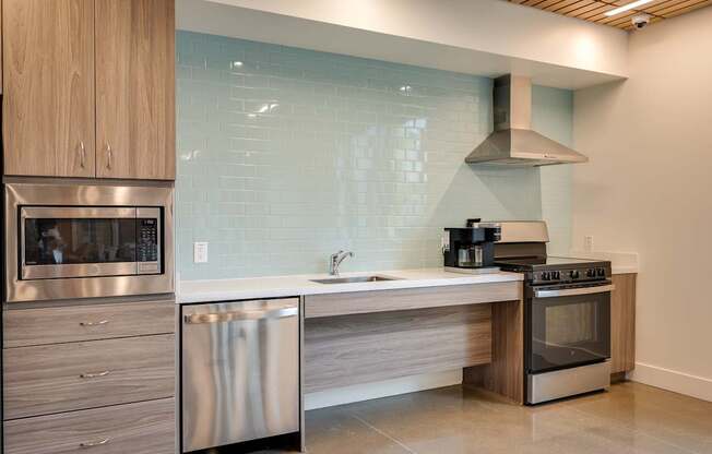 a kitchen with stainless steel appliances and a sink