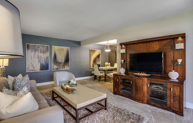 a living room with a fireplace and a television