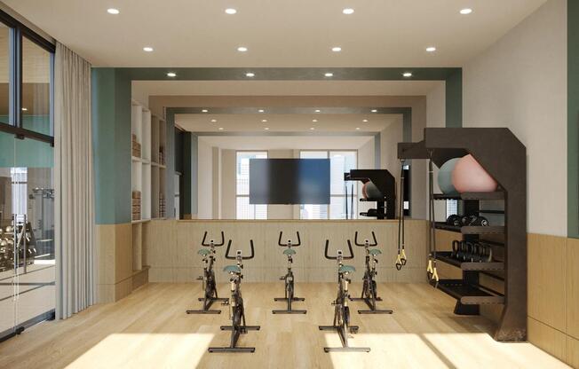 Find your zen in our yoga and pilates studio with Peloton spin bikes.