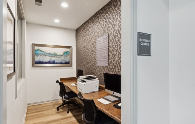 Our resident business center with two desks and a computer