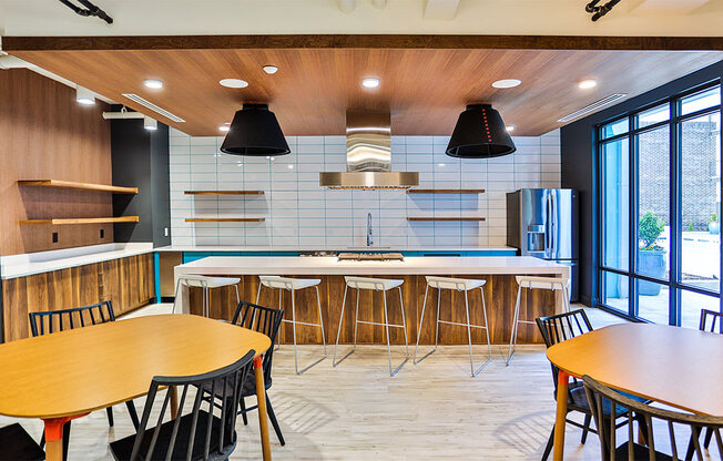 Clubhouse Kitchen Breakfast Bar with Stools at Link Apartments® Montford, Charlotte, NC