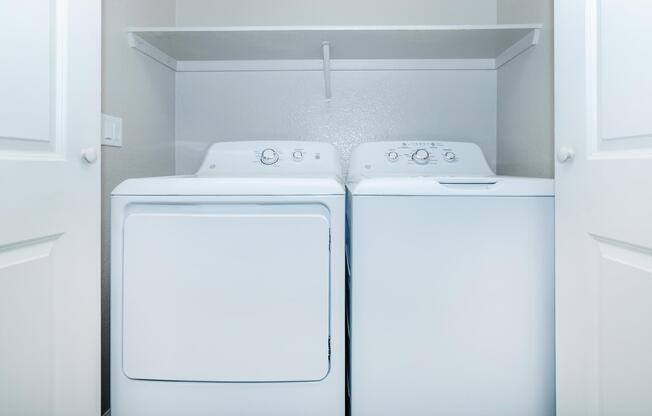 a microwave oven sitting on top of a refrigerator