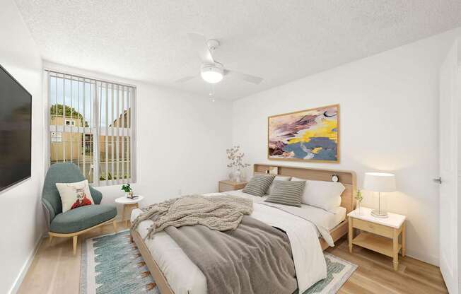 a bedroom with a large bed and a tv