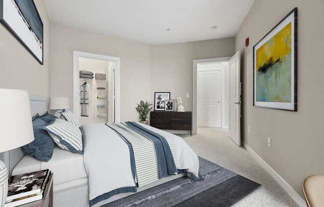 A bedroom with a bed, nightstand, and a painting on the wall.