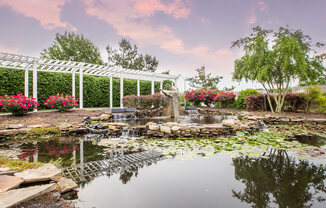 Pond with trellis at Crosstimbers apartments