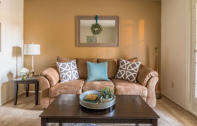 Foothills living room with carpet flooring and a cozy couch