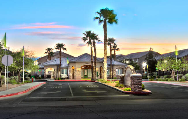 a street in front of a house with palm trees